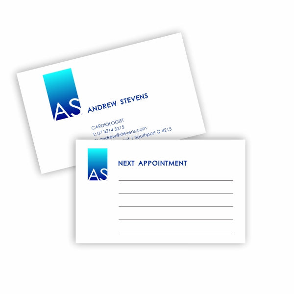 A photograph of a doctor's appointment business cards printed both sides with room to write appointments on the back